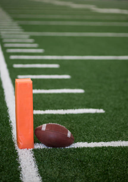 istock Football field end zone ball 878008244