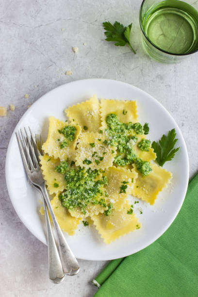 istock Ravioli with pesto sauce 878012302