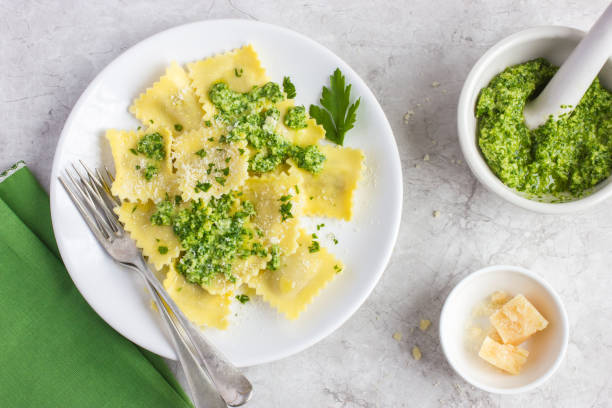 istock Ravioli with pesto sauce 878012326