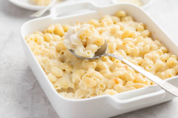 istock baked macaroni and cheese in white casserole dish 878012370