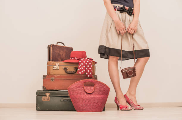 istock Woman Standing Beside Suitcases 878016286