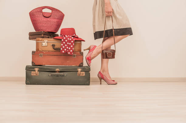 istock Woman Standing Beside Suitcases 878016310