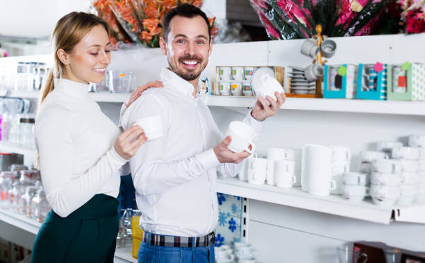 istock Couple selecting crockery in store 878016546