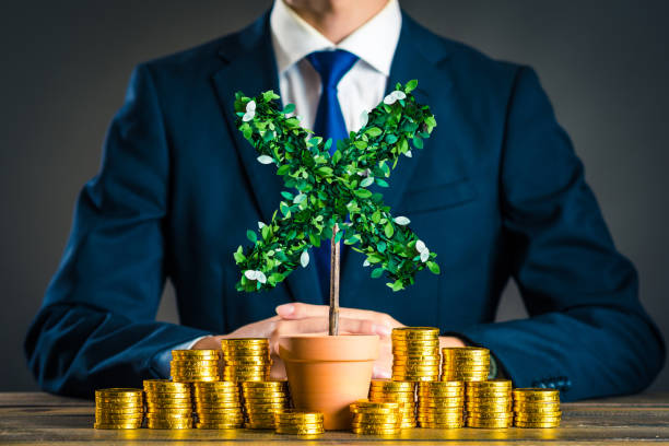 istock Businessmen with plants 878019686