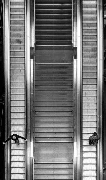 istock Directly Above Shot Of People On Escalator 878021982