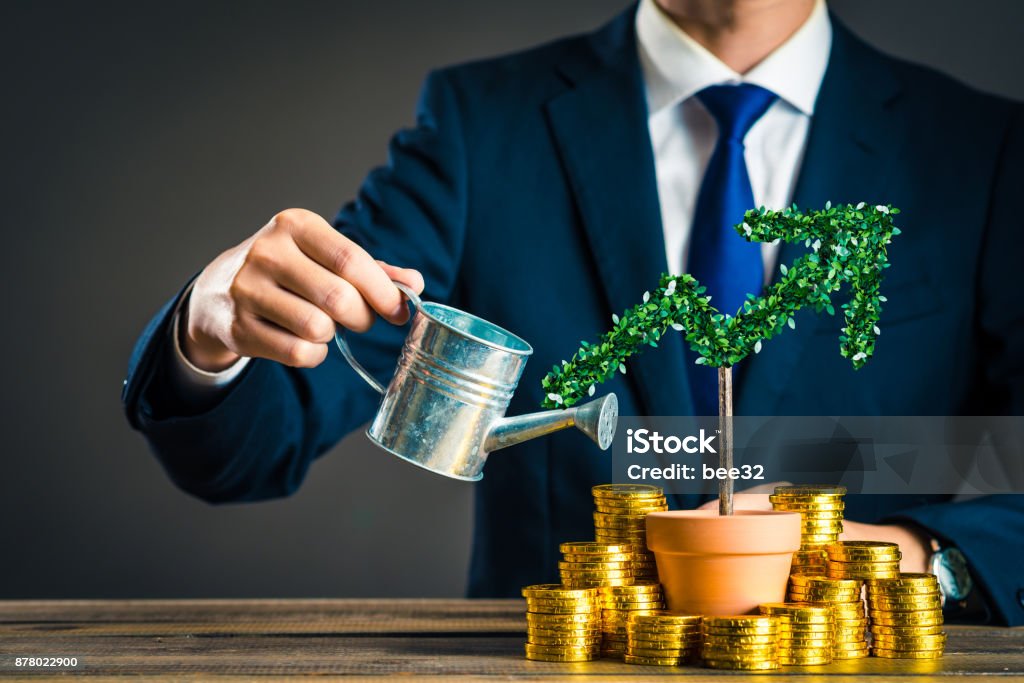 Businessmen with plants Investment Stock Photo