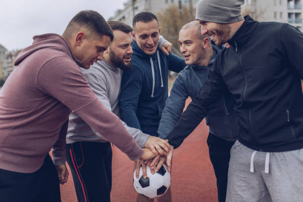istock Football team in a huddle 878037594