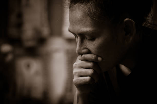 Sad Asian wonab in black and white