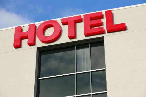 istock Hotel sign on side of building. 878046376