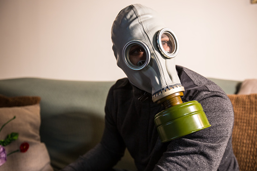 Civilian wearing nuclear gas mask during nuclear fallout