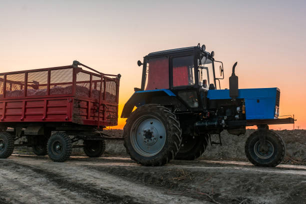 istock Farm tractor with a trailer 878078118