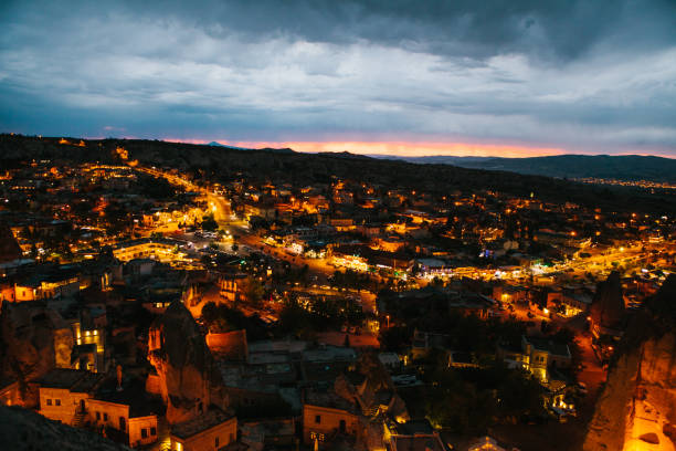 A small authentic city called Goreme in Cappadocia in Turkey. Dramatic night sky. Sunset