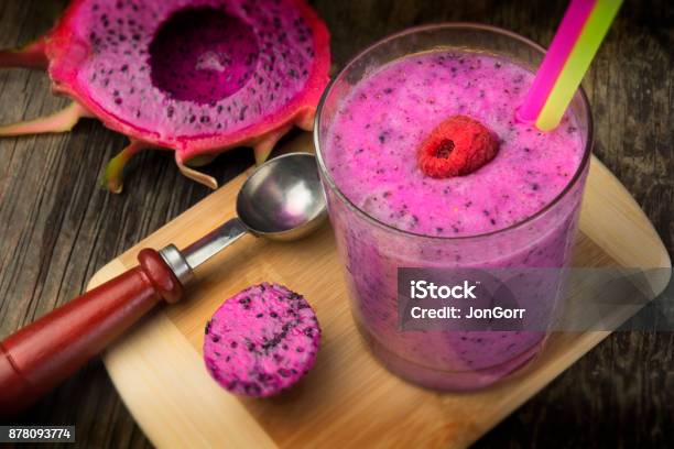 Dragonfruit Purple Smoothie Drink With Rasberry And Straws Stock Photo - Download Image Now