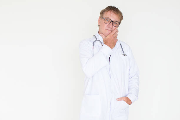 istock Thoughtful Mature Doctor Touching Face 878119202
