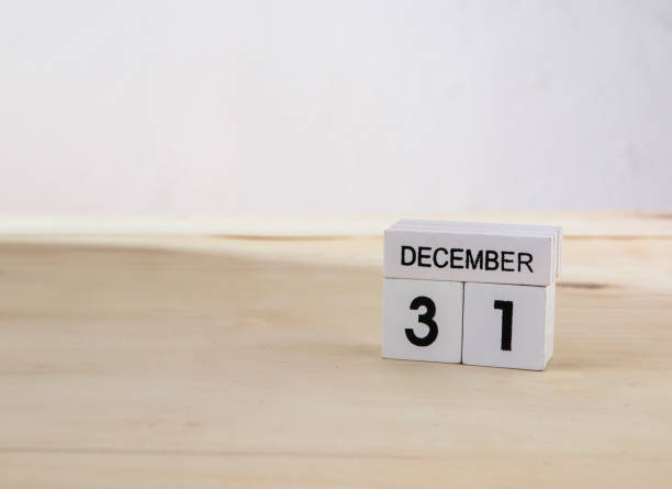 istock 31 December wooden cube calendar on wood surface with copy space 878122404