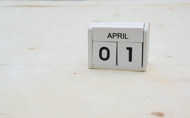 istock april wood cube calendar on wooden table with copy space 878122446