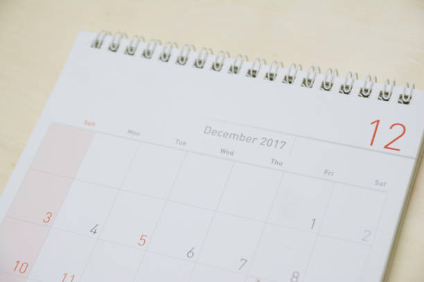 istock close up december calendar on wood table,selective focus 878122508