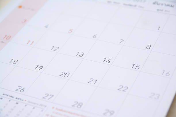 istock close up calendar on wood table,selective focus 878122512