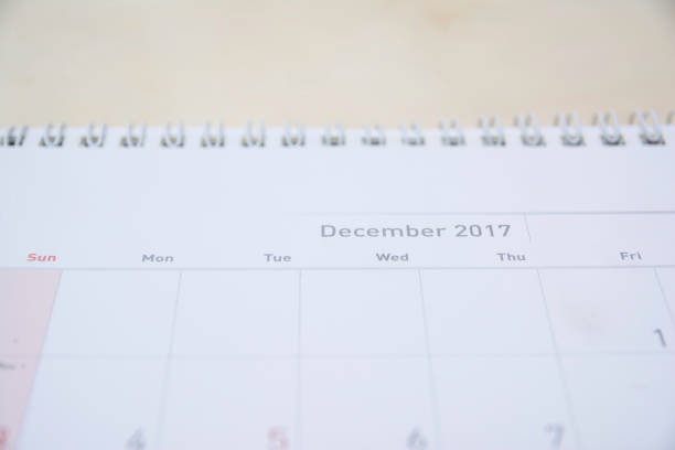 istock close up december calendar on wood table,selective focus 878122522