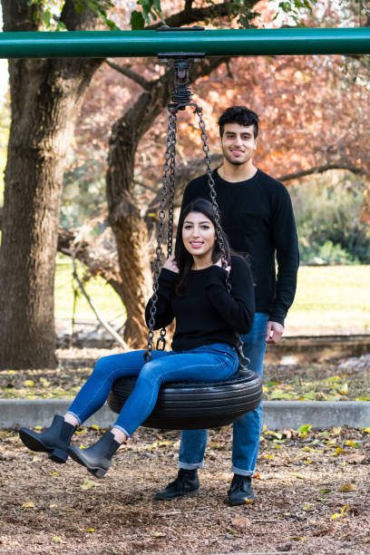 istock young couple having fun at the park 878122566