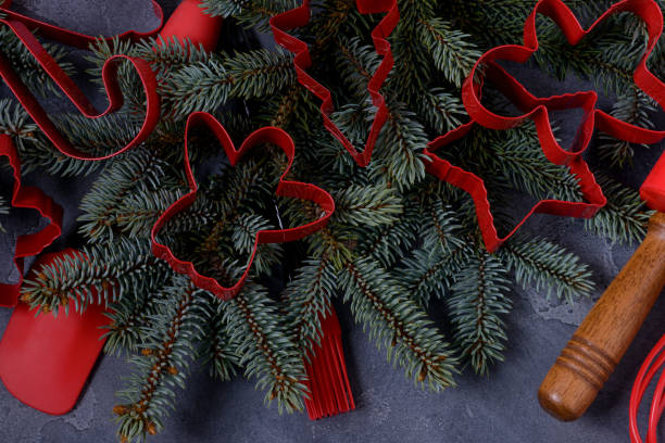 istock Closeup red cookies cutters and utensils 878124780