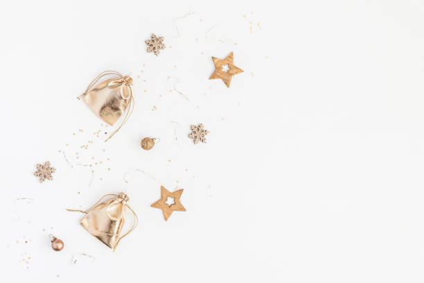 istock Christmas gifts, pine cones, golden decorations. Flat lay, top view 878140196
