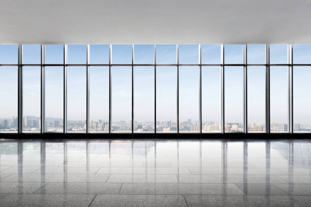 istock empty office with modern cityscape in foggy day 878140928