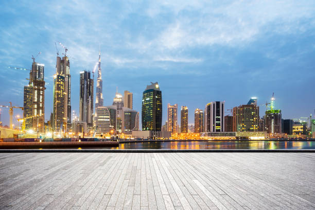 istock empty marble floor with modern buildings at twilight 878141044