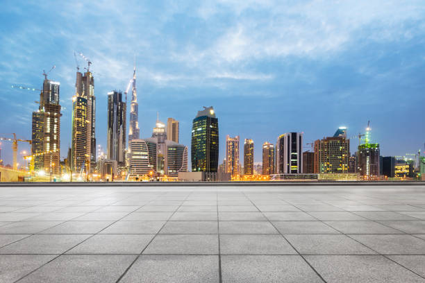 istock empty marble floor with modern buildings at twilight 878143326
