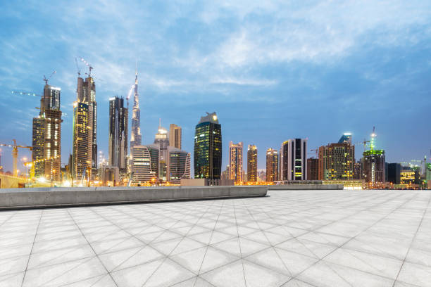 istock empty marble floor with modern buildings at twilight 878143424