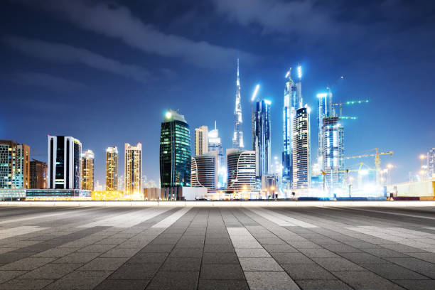 istock empty marble floor with modern buildings at night 878143546
