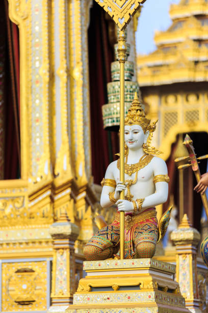 Guardian statues of Him-ma-pan forest at the royal crematorium of His Majesty late King Bhumibol Adulyadej built. Bangkok, Thailand - November 12, 2017 :Guardian statues of Him-ma-pan forest at the royal crematorium of His Majesty late King Bhumibol Adulyadej built for the royal funeral at Sanam Luang. funeral home chairs stock pictures, royalty-free photos & images