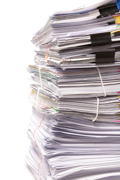 istock Stack of business papers isolated on white background 878150008