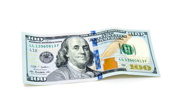istock One hundred dollars banknotes isolated on white background 878154736