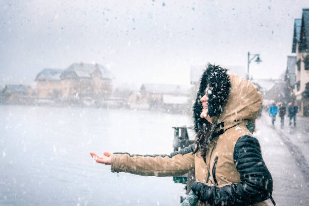 istock Happy woman on a snowy day 878155344