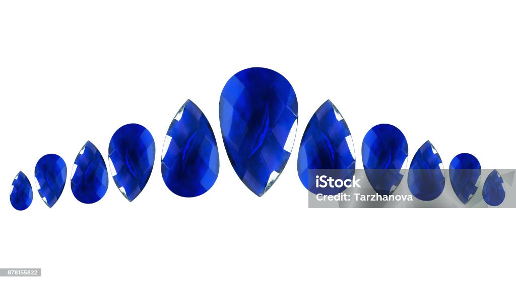 Group of sapphires Group of drop shaped faceted sapphires on white background Abstract Stock Photo