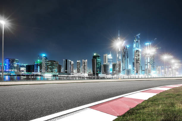 istock empty asphalt road with modern buildings at night 878164364