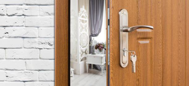 istock Half open door of a room, handle closeup. 878164596