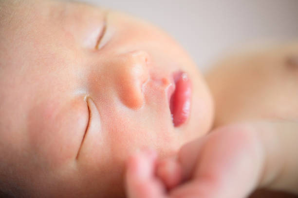 istock Close up Asian new born baby sleeping 878170354