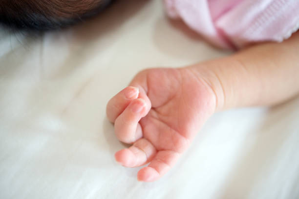 istock Newborn baby hand 878173484
