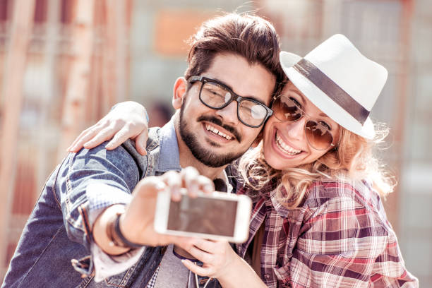 istock Young couple hugging in the city 878176246