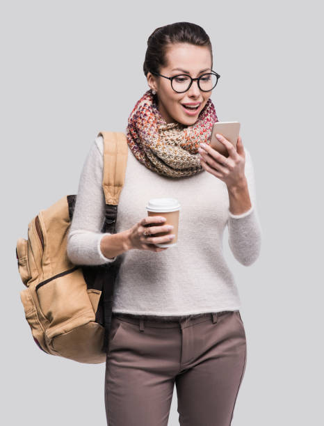 istock Surprised young student girl using smart phone 878176382