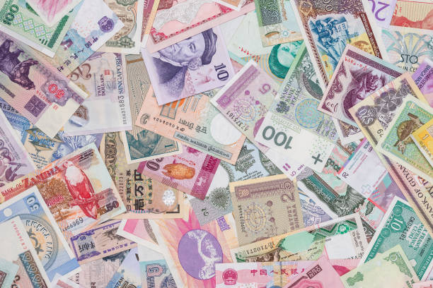 istock world paper money as background. close up 878177414