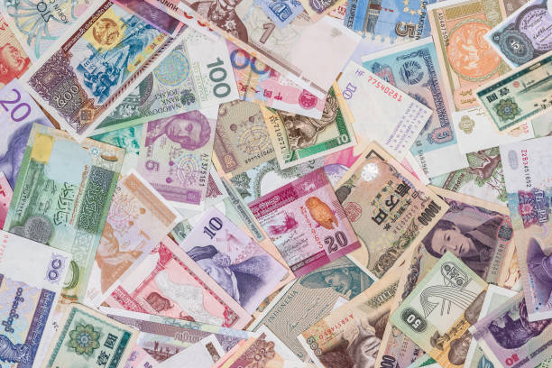 istock world paper money as background. close up 878181872