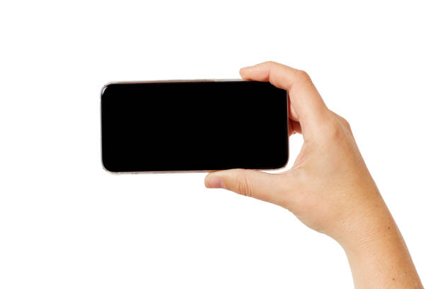 istock Hand holding smartphone aloft to take photograph 878192388