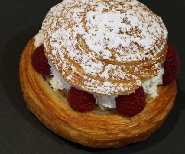 istock cake with raspberries and whipped cream 878196420