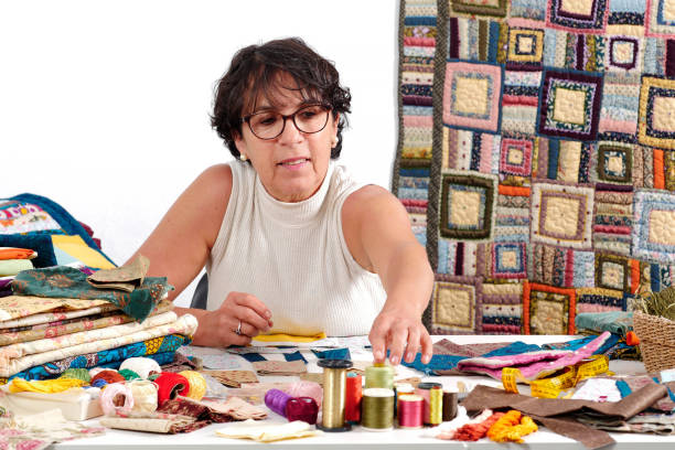 istock a mature brunette woman sewing patchwork 878205516