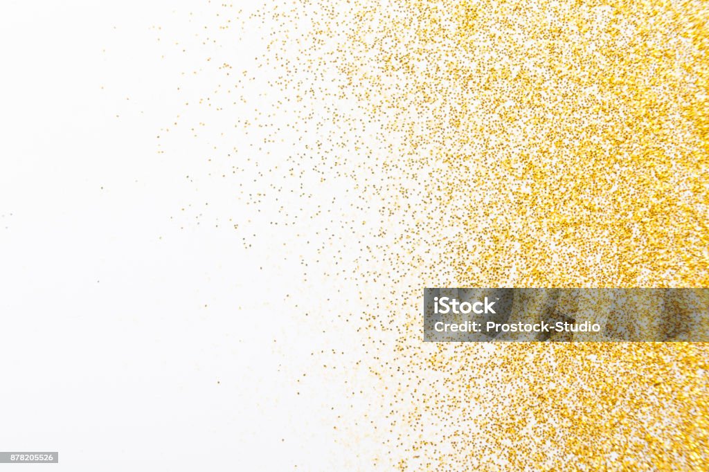 Golden glitter sand texture, abstract background. Golden glitter sand texture on white, abstract background. Yellow dusty shimmer decoration, shiny and sparkling frame, top view, copy space. Holidays and glamour concept. Gold - Metal Stock Photo