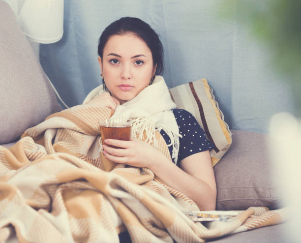 istock Ill girl wrapping in blanket 878205798