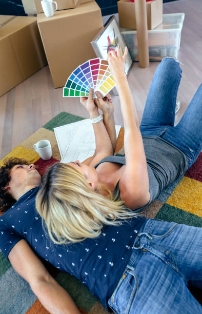 istock Couple choosing color and resting 878209204